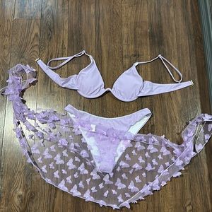 purple bikini with butterfly cover up.